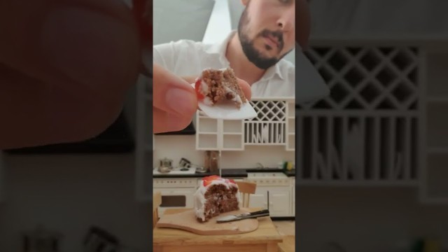 'Eating miniature real food strawberry cake in miniature kitchen'