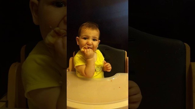 'E eating pizza @ 10 months old'