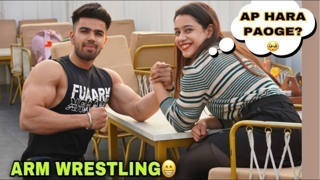 'ARM WRESTLING WITH FITNESS GIRL