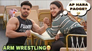 'ARM WRESTLING WITH FITNESS GIRL