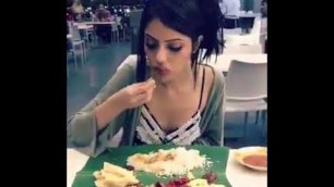 'FOREIGNER EATING INDIAN FOOD IN BANANA LEAF'