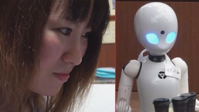 'Woman in Wheelchair Uses Robot Waiter to Serve Food to Customers'