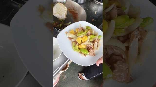 'Fried beef with vegetables and fish soup, Cambodian street food'