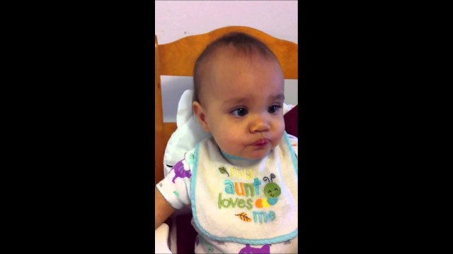 '10 months old baby eating orange for the first time'