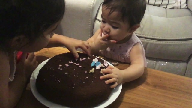 '10 months old baby eating her cake !'