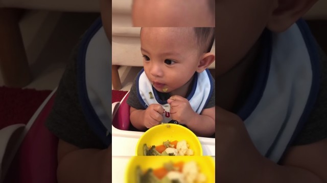 '10 months old eating broccoli carrots and cauliflower