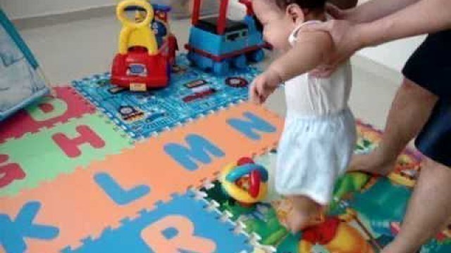 '10 months old baby playing soccer'