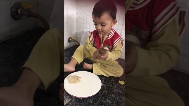 '10 months old smart kid prannu helping mom in kitchen,too cute.'