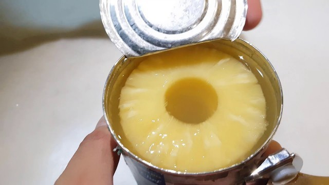 'How to open canned food with can opener tool'