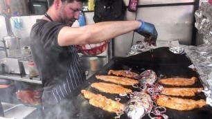 'Cooking Lot of Fish on Grill. Mediterranean Street Food, London'