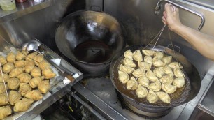 'Singapore Street Food. Crispy Puff, with Sardine, Chicken, Curry, Black Pepper'