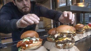 'Double Burger Covered with Melting Cheese. Street Food of Camden Town, London'