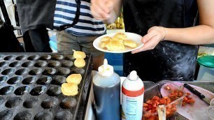 'London Street Food. Sweet Dutch Pancakes \"poffertjes\" eaten at Camden Lock Market'